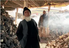  ?? WASHINGTON POST ?? Firewood seller Baba Pahlawan, 70, says most customers can afford to buy only a few sticks of firewood at a time as the winter cold begins.