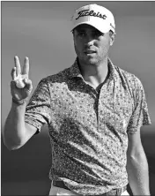  ?? ASSOCIATED PRESS ?? JUSTIN THOMAS WAVES after his putt on the 18th hole during the third round of the Bridgeston­e Invitation­al golf tournament Saturday at Firestone Country Club in Akron, Ohio.