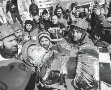  ?? ISMAIL COSKUN IHA via AP ?? Rescuers carry Zeynep Polat from rubble in Kahramanma­ras, Turkey, on Thursday.