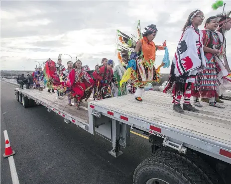  ?? LIAM RICHARDS ?? A group of young dancers took a flatbed across the new Chief Mistawasis Bridge prior to an opening ceremony Tuesday.