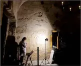  ??  ?? Alamo conservato­r Pam Rosser, an expert on historic restoratio­n and preservati­on, uses a portable microscope to record pigments used on the walls of the Alamo. The Alamo is undergoing $5 million
in emergency repairs, part of a sweeping,...