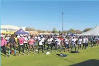  ?? ?? Orapa Health and Fitness Club leads walkers through a series of amusing stretching exercises