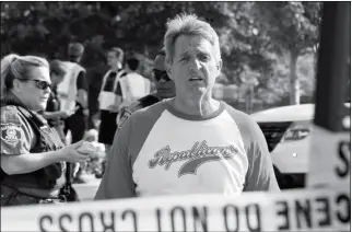  ?? ASSOCIATED PRESS ?? SEN. JEFF FLAKE, R-ARIZ., WALKS TOWARD MEDIA gathered at the scene of a shooting at a baseball field in Alexandria, Va., on Wednesday during a Congressio­nal baseball practice where House Majority Whip Steve Scalise of La. was shot.