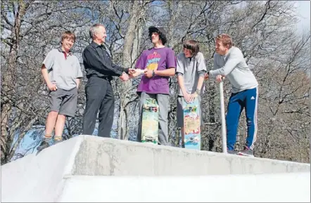  ??  ?? Massive effort: Eli Hughes, 16, hands over a cheque to Rotary president Graeme Guilford on behalf of the skate park youth. Also pictured are Dallas Mattock, 13, Andre Hughes, 14, and youth co-ordinator Jono Bay.