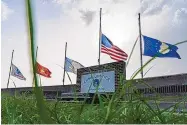  ?? ALEX BRANDON/ASSOCIATED PRESS ?? Flags fly at half-staff at Camp Justice in Guantanamo Bay Naval Base, Cuba, where three prisoners had their first day in court Monday after 18 years in U.S. custody.