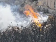  ??  ?? HOTSPOT: Fire in rocky terrain near Lake Augusta Rd.