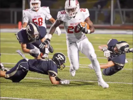  ?? SAM STEWART - DIGITAL FIRST MEDIA ?? Wilson’s Iggy Reynoso leaves Spring-Ford defenders behind en route to a 64-yard touchdown in the second quarter.