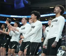  ?? POWERS IMAGERY ?? Colorado players, including J’vonne Hadley, right, and KJ Simpson, third from right, celebrate during the Pac-12tourname­nt first round against Washington at T-mobile Arena in Las Vegas on Wednesday.