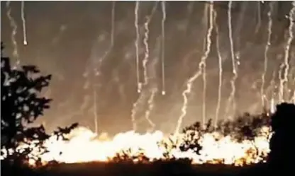  ??  ?? Alleged war crime: A photograph showing what appears to be white phosphorus falling on Raqqa