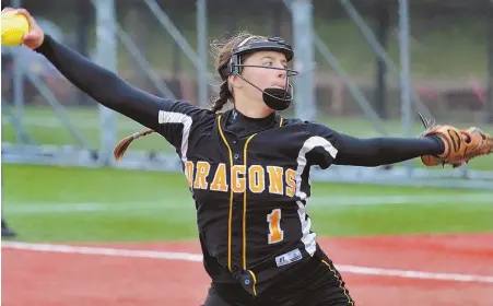  ?? STAFF PHOTO BY CHRIS CHRISTO ?? SPINNING A GEM: Olivia McGrath gets ready to deliver a pitch during Latin Academy’s 7-2 victory against O’Bryant in yesterday’s Boston City League championsh­ip game.