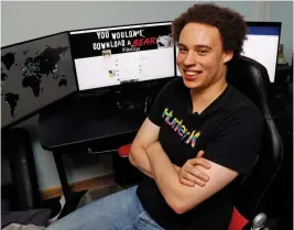  ?? — AP ?? British IT expert Marcus Hutchins who has been branded a hero for slowing down the WannaCry global cyber attack, sits at his workstatio­n during an interview in Ilfracombe, England