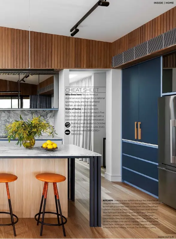  ??  ?? KITCHEN Creating a new skillion roof was the brainchild of designer Alexandra Marrotte. The facing battens are blackbutt timber with a Grey Mist stain. Underneath, the polyuretha­ne cabinetry is a mix of Dulux colours: Grid (dark blue), Spartan Blue (light blue) and Kinder Quarter (light grey). Smokey mirrored cabinets, DecoGlaze. Benchtops, Super White Dolomite (on benchtops and spashback), CDK Stone. Linear Slimline pendant (over island), Lighting Collective. Hof stools, Great Dane. Wave vase, Jardan. Vintage ceramic, Conley & Co. Artwork by Rina Freiberg, through The Wellington Gallery.