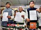  ?? PTI ?? BJP state president Nityanand Rai (R) with JD (U) state president Vashisht Narayan (C) and LJP state president Pashupati Paras (L) show the candidates' list for upcoming Lok Sabha election 2019, in Patna, Sunday