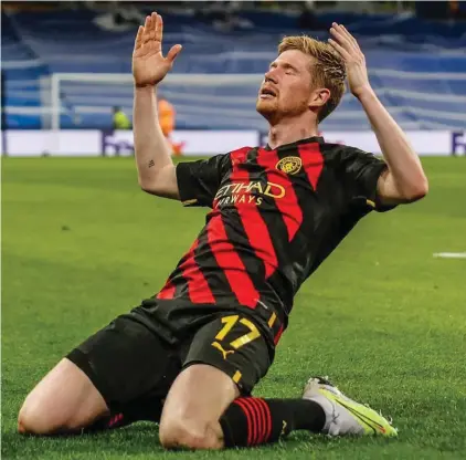  ?? ?? TOP Manchester City's Kevin De Bruyne celebrates after scoring his side's first goal during the Champions League semifinal first leg soccer match between Real Madrid and Manchester City at the Santiago Bernabeu stadium in Madrid, Spain, Tuesday, May 9, 2023.