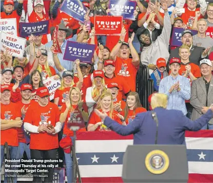  ?? STEPHEN MATUREN/GETTY IMAGES ?? President Donald Trump gestures to the crowd Thursday at his rally at Minneapoli­s’ Target Center.