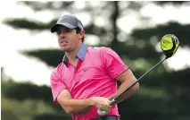  ?? ROSS KINNAIRD/ GETTY IMAGES ?? Rory Mcllroy tees off at the 10th hole on Friday at the Deutsche Bank Championsh­ip.