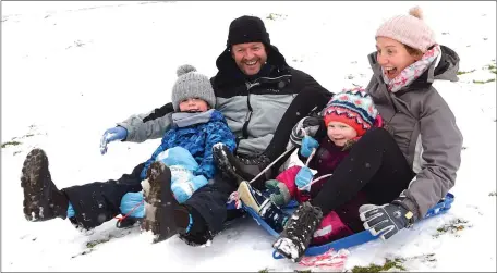  ?? Photo by Michelle Cooper Galvin ?? Alan, Shirley, Ben and Kate Corcoran enjoying the snowy weather at Killarney National Park, Killarney on Friday.