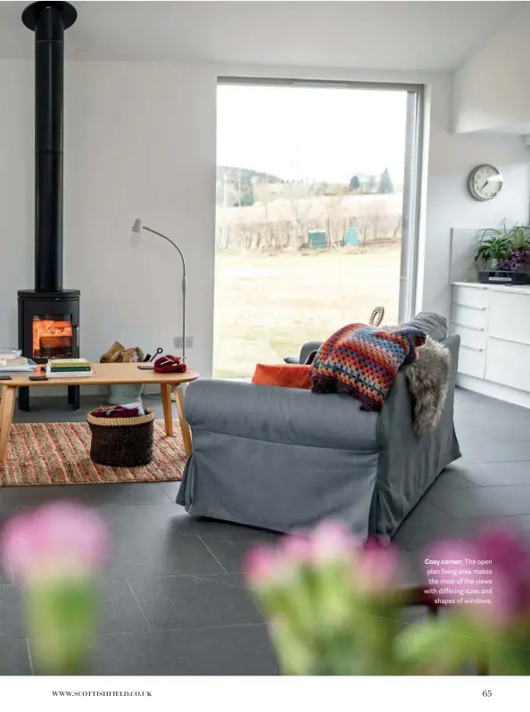  ??  ?? Cosy corner: The open plan living area makes the most of the views with differing sizes and shapes of windows.