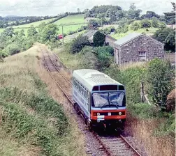  ?? TONY GRAY ?? BREL-designed
No. RB3 was primarily used by Northern Ireland Railways on the Portrush branch. However, before withdrawal in 1992, it strayed off NIR metals to operate the Cavan Coup railtour on July 28, 1990. It operated from Belfast to Drogheda and then on to the now closed Iarnród Éireann’s freight only line to Kingscourt which closed from Navan in November 2001. It is seen passing Nobber Station on the return leg.