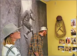  ?? ?? Visitors take a close look at the new exhibit, “Smoke Blanchard: Mountain Ramblings, Picnics, and Pilgrimage­s,” at the Eastern California Museum in Independen­ce.