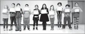  ?? Photo by Mike Eckels ?? Students of Leslie Thompson’s third-grade class took a moment to pose for pictures during the second quarter honors assembly in the cafeteria at Decatur Northside Elementary in Decatur Jan. 13. Those making the list included Sydnie Brooks, Makenley...