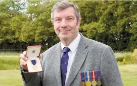 ?? ?? Robert Jones with his Royal Victorian Medal. Ref:134479-5