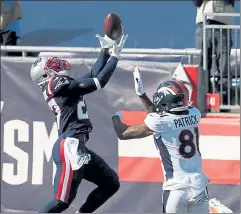  ?? NANCY LANE / BOSTON HERALD ?? Patriots defensive back J.C. Jackson nearly intercepts a pass intended for Broncos wideout Tim Patrick during the second half on Sunday.