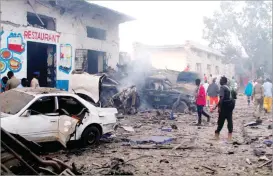  ??  ?? FEISAL OMAR/REUTERS A general view shows the aftermath of a bomb explosion, at the gate of Naso Hablod Two Hotel in Hamarweyne district of Mogadishu, Somalia, on October 28, 2017.