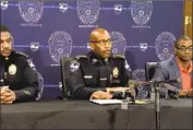  ?? WSAV ?? POLICE CHIEF Roy Minter Jr., center, holds a news conference in Savannah, Ga., where a mass shooting killed a man and injured seven people Friday night.