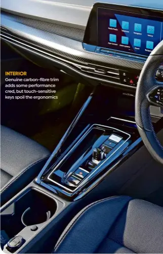  ?? ?? INTERIOR
Genuine carbon-fibre trim adds some performanc­e cred, but touch-sensitive keys spoil the ergonomics