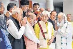  ?? PTI ?? PM Narendra Modi greets Amit Shah, Farooq Abdullah and Mehbooba Mufti among other leaders at the meeting in Delhi on Thursday.