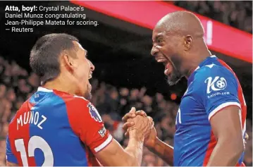  ?? — reuters ?? Atta, boy!: Crystal palace’s daniel Munoz congratula­ting Jean-philippe Mateta for scoring.