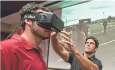  ?? WALT BEAZLEY, RAZORBACKS COMMUNICAT­IONS ?? Arkansas quarterbac­k Brandon Allen raved about STriVR Labs’ virtual reality, created by CEO Derek Belch, right.