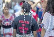  ?? David McNew Getty Images ?? DANCERS get ready to perform at a festival in Hollywood on Oct. 8 celebratin­g Indigenous Peoples Day.