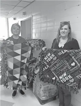  ?? / Contribute­d ?? CASA staff receive another delivery of blankets from Cedartown First United Methodist Church during a season of giving.