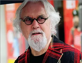  ??  ?? STUNNED: Sir Billy Connolly, at the scene of the blaze yesterday, said he was ‘horrified’