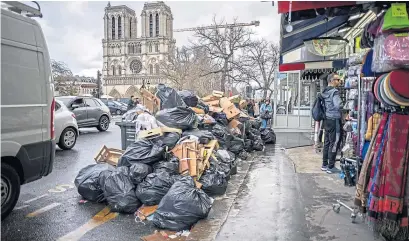  ?? ?? Rubbish piled up near Notre Dame in Paris as French workers strike over pension reforms