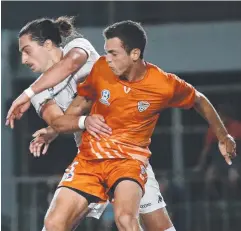  ??  ?? TOE-TO-TOE: Mackay’s Kyle Markham and Cairns FC’s Joe Zupo.