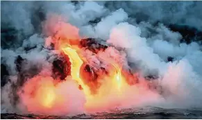  ??  ?? Streams of lava flowing into the sea from Kilauea, the most active of the five volcanoes that make up Hawaii.