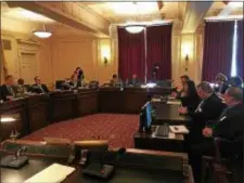  ?? DAVID FOSTER — THE TRENTONIAN ?? Hamilton Councilwom­an Ileana Schirmer (seated right at table) with her Hamilton Council colleagues at a State Assembly Telecommun­ications and Utilities Committee hearing on Thursday to address issues at Trenton Water Works.