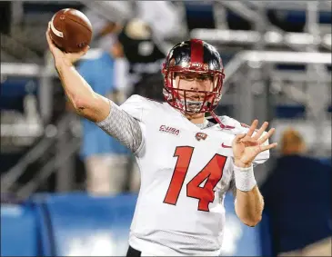  ?? JOEL AUERBACH / GETTY IMAGES ?? Western Kentucky quarterbac­k Mike White will challenge Georgia State’s questionab­le pass defense. White led Conference USA in passing yardage and completion­s despite 42 sacks.