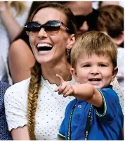  ?? REX ?? Look who’s won: Djokovic’s son Stefan and wife Jelena celebrate his victory