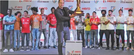  ?? — PTI — BIPLAB BANERJEE ?? Indian Football team coach Igor Stimac poses with the trophy along with 11 team members at the launch of the 13th edition of the Hero I-Leauge in New Delhi on Thursday.