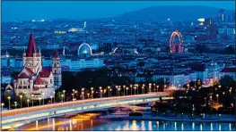  ??  ?? ILLUMINATI­NG: The beautiful Austrian capital city of Vienna lit up at night