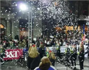  ?? FRAN MAYE - DIGITAL FIRST MEDIA ?? Confetti takes to the air during the West Chester Christmas Parade.