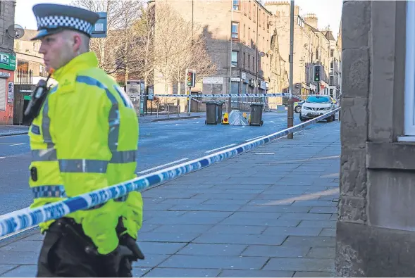  ??  ?? Police in attendance at Albert Street, Stobswell, following the discovery of John Watt’s body on Sunday.