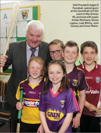  ??  ?? GAA President Aogán Ó Fearghaíl, special guest at the countdown to Féile event in Murrintown NS, pictured with pupils Amber McCleane, Nicola Lageau, Luke Whitty, Josh Cooney and Conor Maher.