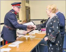  ??  ?? Vice Lordlieute­nant of Staffordsh­ire Mr Graham Stow CBE DL presents trustee Doris Barratt with the Queen’s award certificat­e. Mick Price, the husband of the late Pat Price received the crystal award.