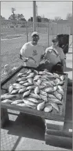  ??  ?? Pictured above is local angler Carlton “Bubba” Teague and son, Corey, at the age of 11, after a Good Friday Fishing Trip on Weiss Lake.