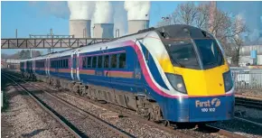  ?? ?? Despite their less than successful career on FGW and Great Western routes, the fivecar Class 180 is a compelling subject for a scale model. No. 180102 was photograph­ed at Didcot Parkway on November 27, 2003. This scene has changed beyond recognitio­n over the last 20 years with electrific­ation and demolition of the power station.